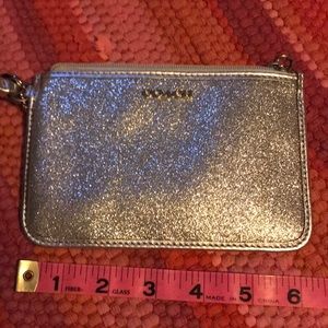 Silver shimmered Coach wristlet